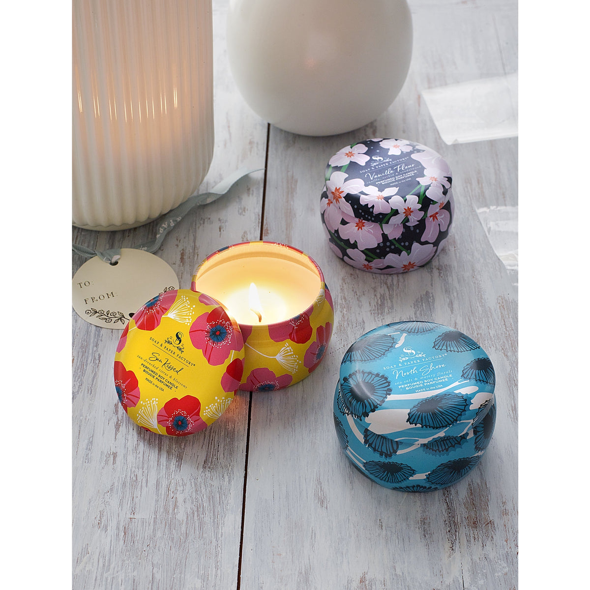 Soap &amp; Paper Factory Small Tin Candle Trio Sun Kissed Citrus, North Shore, Vanilla Fleur set of 3, 3oz burn time 18 hours - Brought to you by Luxe &amp; Lark