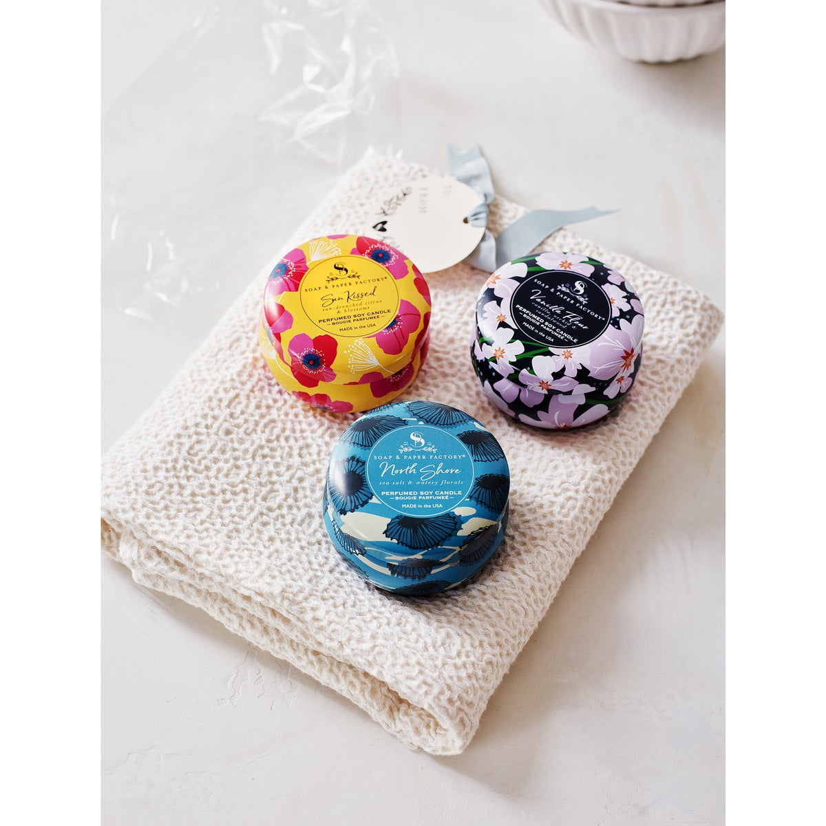 Soap &amp; Paper Factory Small Tin Candle Trio Sun Kissed Citrus, North Shore, Vanilla Fleur set of 3, 3oz burn time 18 hours - Brought to you by Luxe &amp; Lark