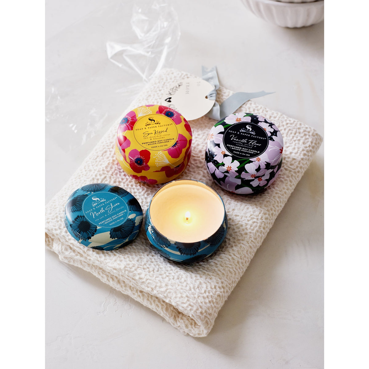 Soap &amp; Paper Factory Small Tin Candle Trio Sun Kissed Citrus, North Shore, Vanilla Fleur set of 3, 3oz burn time 18 hours - Brought to you by Luxe &amp; Lark